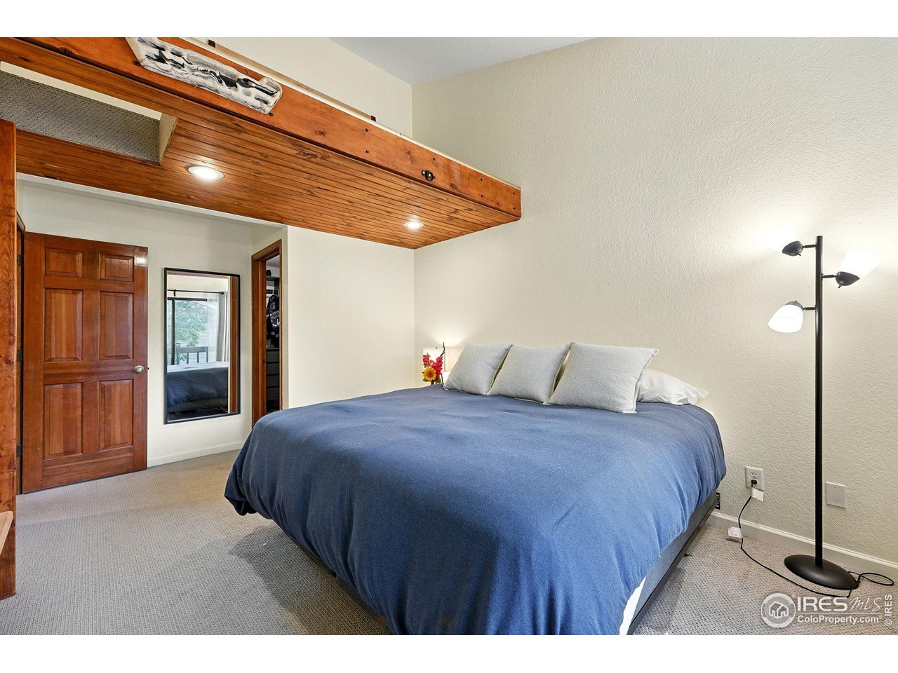 5016 Buckingham Road, Unit 4 Boulder, CO 80301 - Photo 11 of 22 a bedroom with a bed and a walk in closet