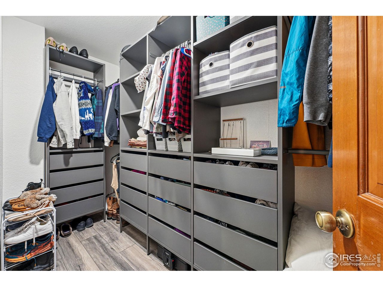 5016 Buckingham Road, Unit 4 Boulder, CO 80301 - Photo 13 of 22 a view of walk in closet with clothes and shoes
