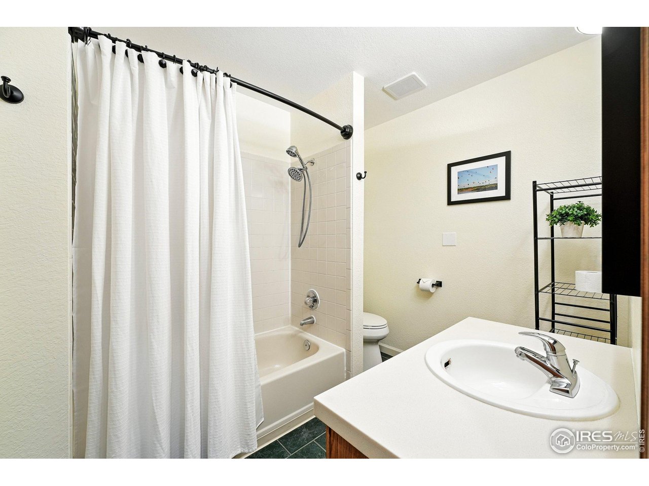 5016 Buckingham Road, Unit 4 Boulder, CO 80301 - Photo 17 of 22 a bathroom with a sink and a mirror