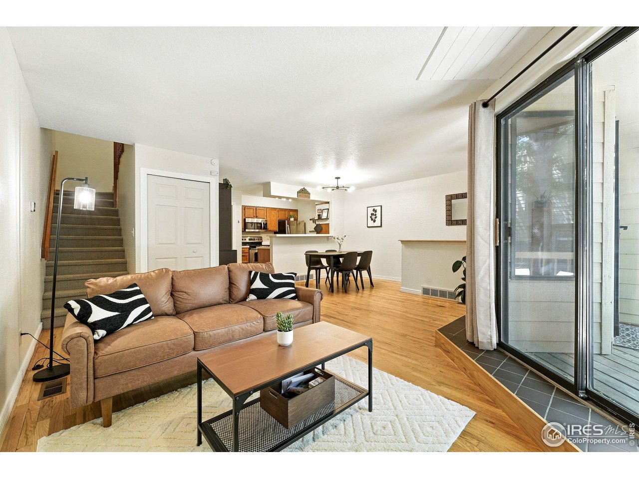 5016 Buckingham Road, Unit 4 Boulder, CO 80301 - Photo 21 of 22 a living room with furniture and wooden floor