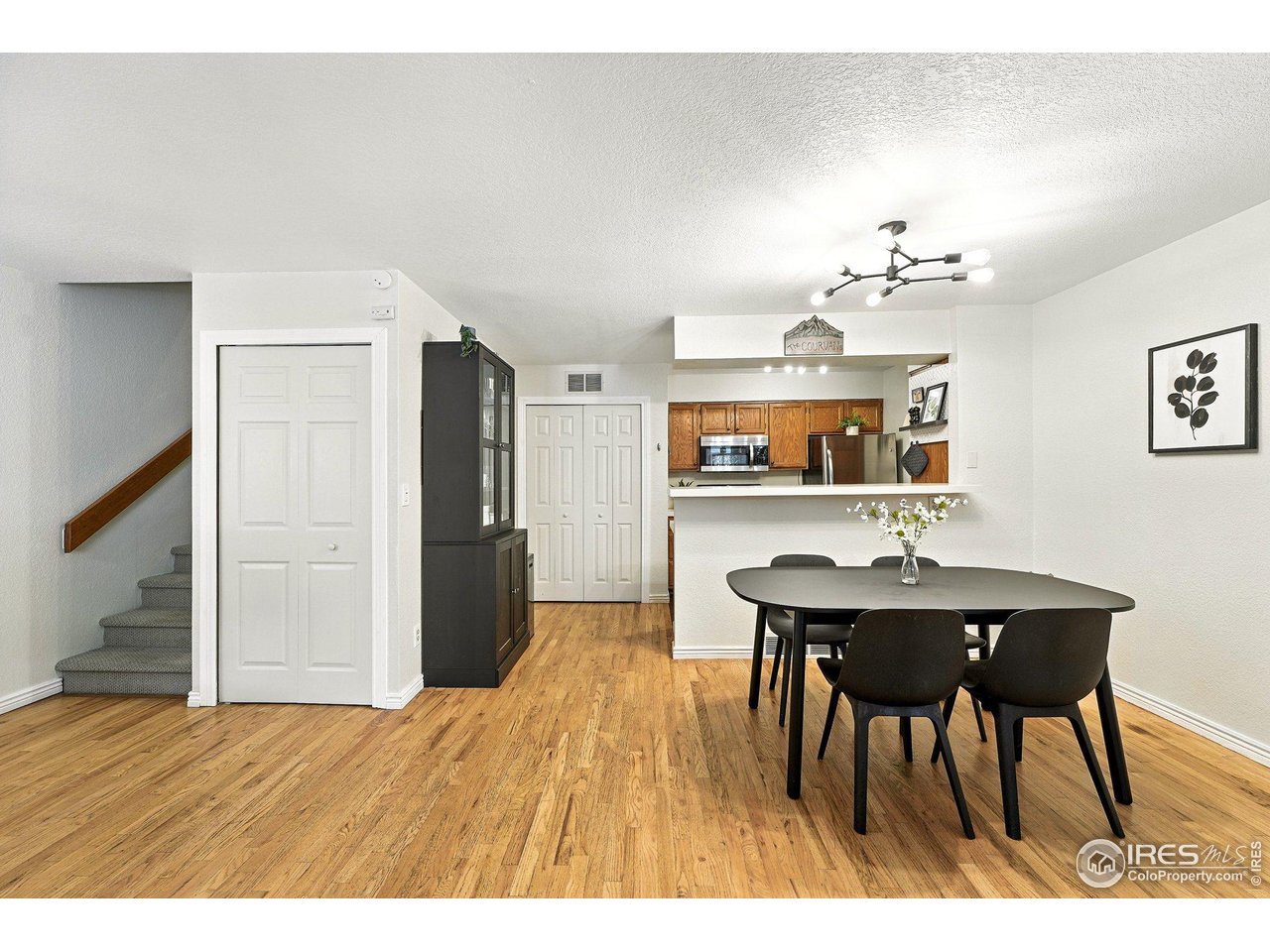 5016 Buckingham Road, Unit 4 Boulder, CO 80301 - Photo 6 of 22 a view of a dining room with furniture