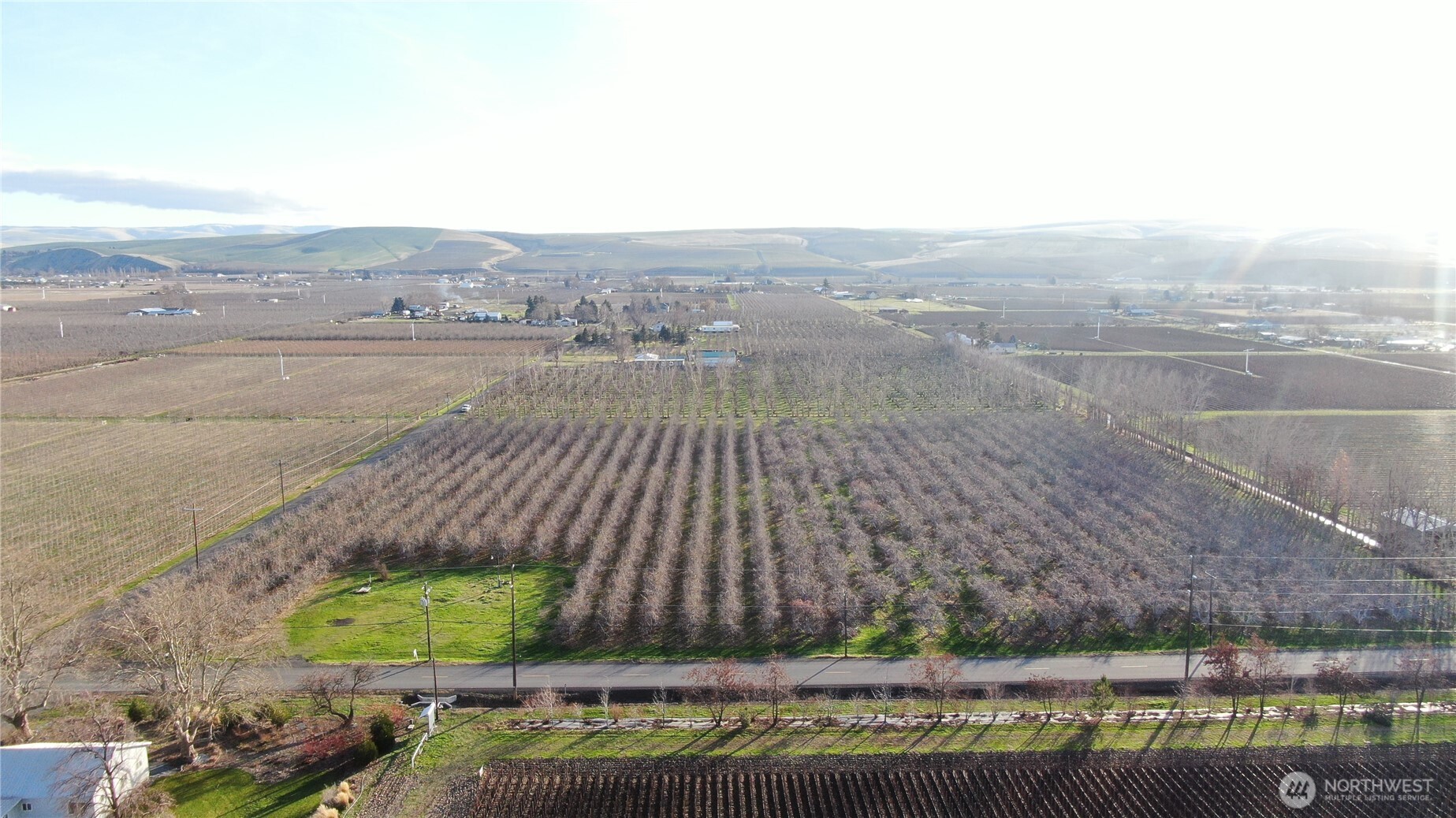 an aerial view of a house with a yard basket ball court and outdoor seating