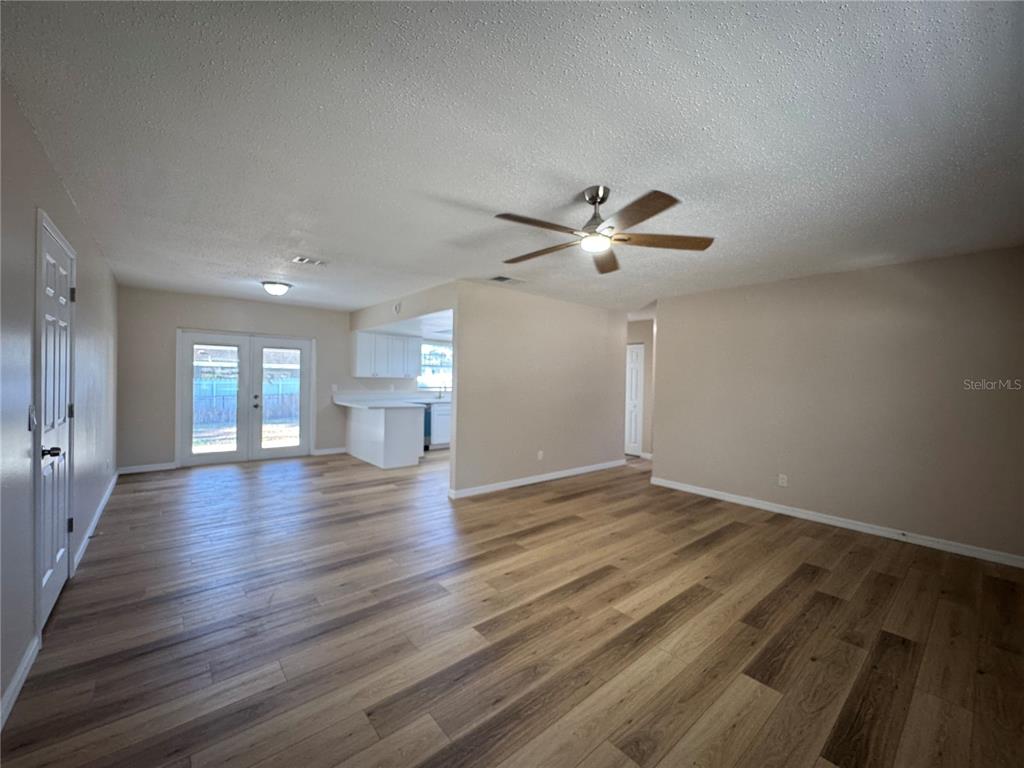 2527 Ridge Top Way Valrico, FL 33594 - Photo 11 of 31 a view of empty room with wooden floor and fan