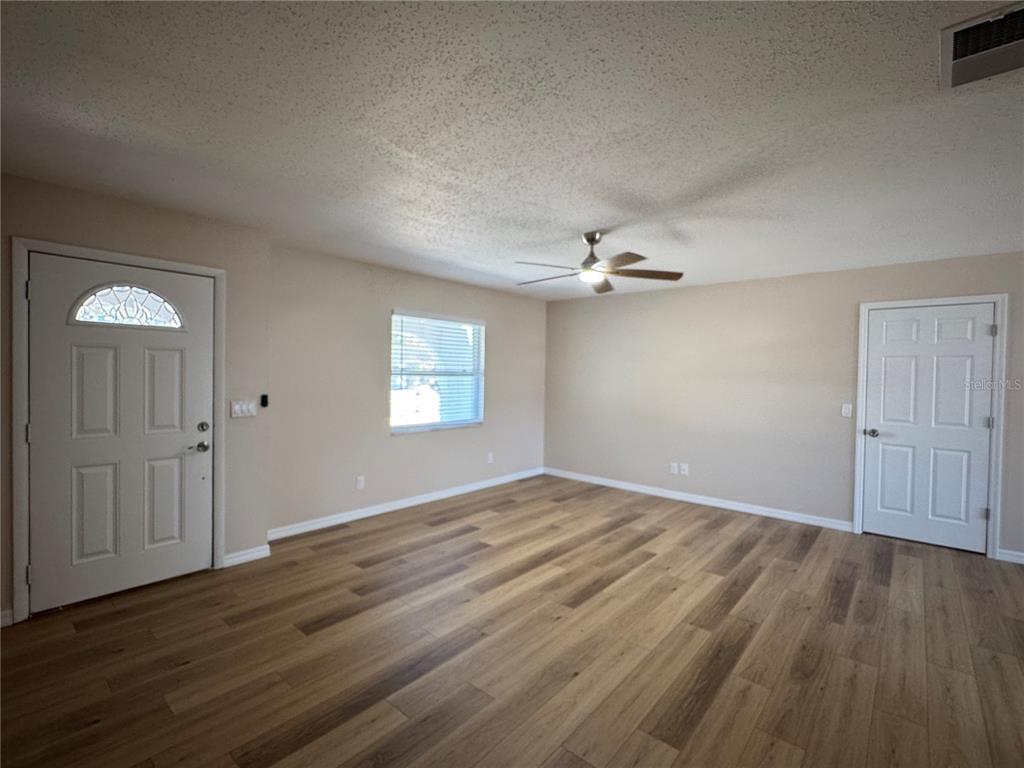 2527 Ridge Top Way Valrico, FL 33594 - Photo 12 of 31 wooden floor in an empty room with a window