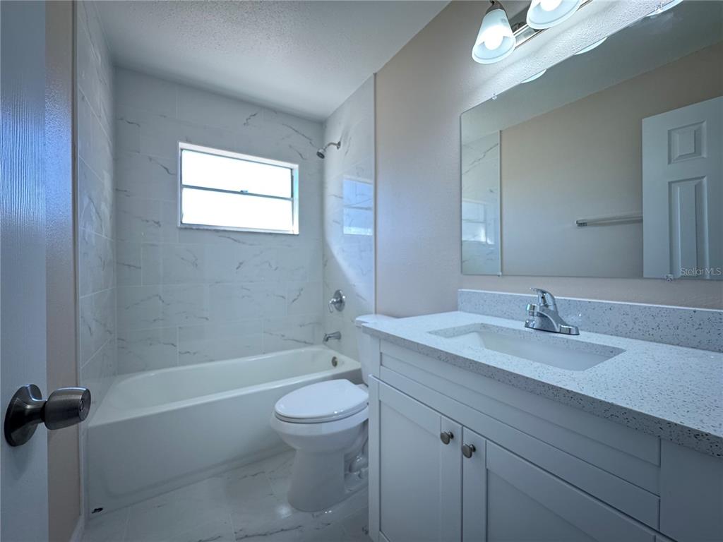 2527 Ridge Top Way Valrico, FL 33594 - Photo 17 of 31 a bathroom with a sink a toilet and shower