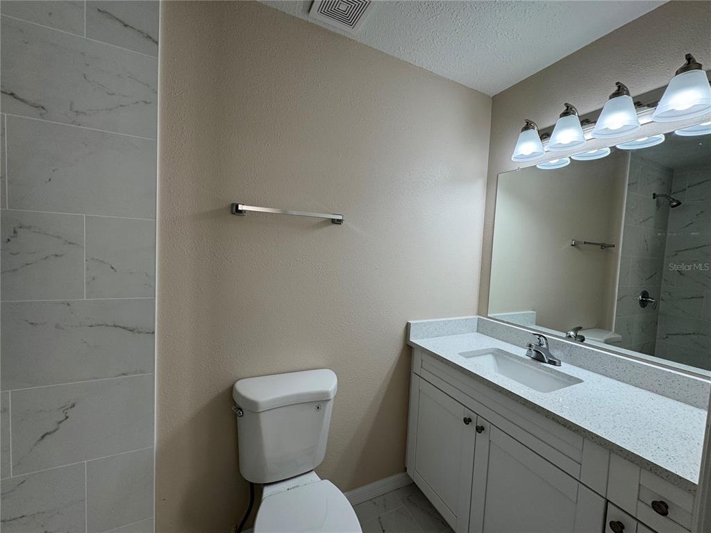 2527 Ridge Top Way Valrico, FL 33594 - Photo 26 of 31 a bathroom with a toilet sink and mirror