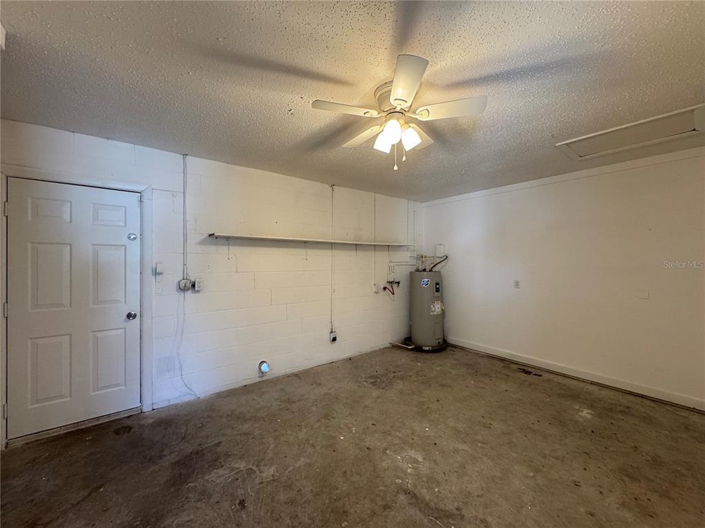 2527 Ridge Top Way Valrico, FL 33594 - Photo 28 of 31 an empty room with a ceiling fan and a window