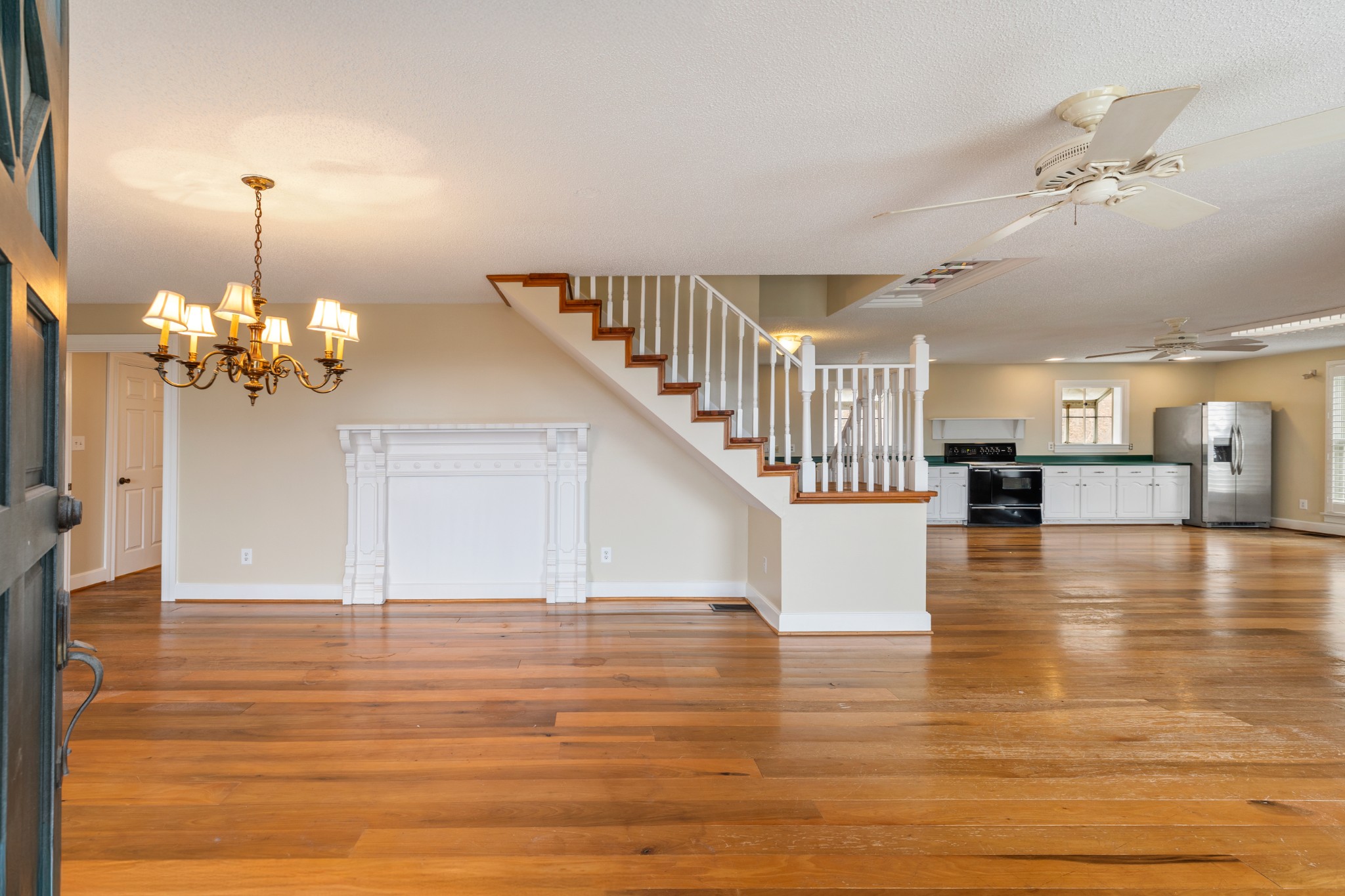 2600 Charlie Thomas Road Cornersville, TN 37047 - Photo 13 of 35 a view of a livingroom with wooden floor and a kitchen
