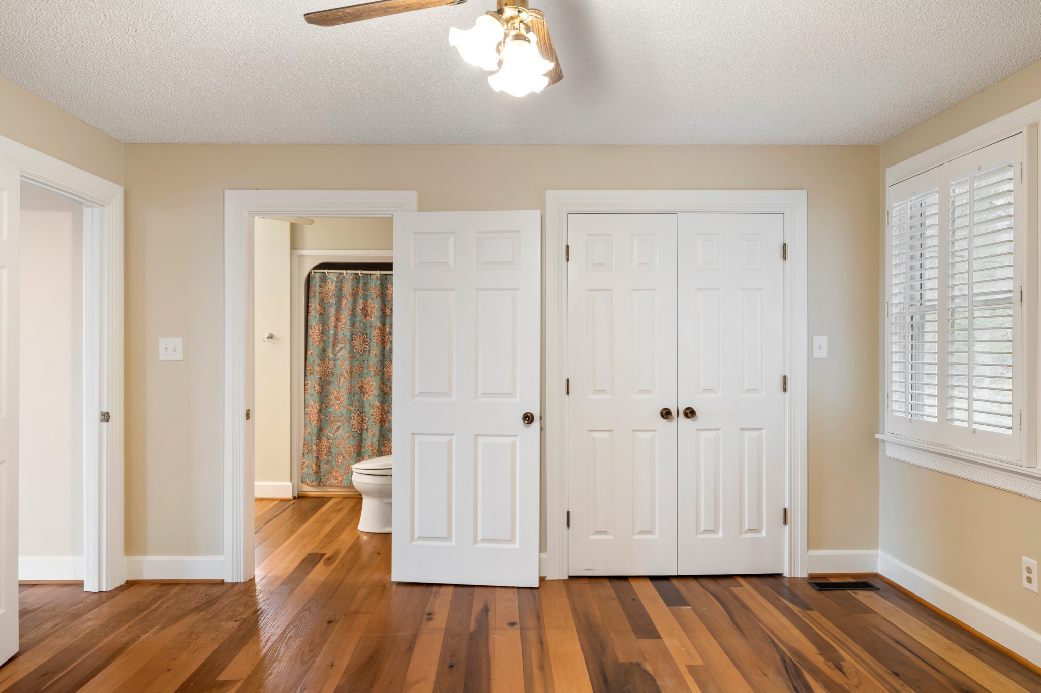 2600 Charlie Thomas Road Cornersville, TN 37047 - Photo 18 of 35 an empty room with wooden floor and windows