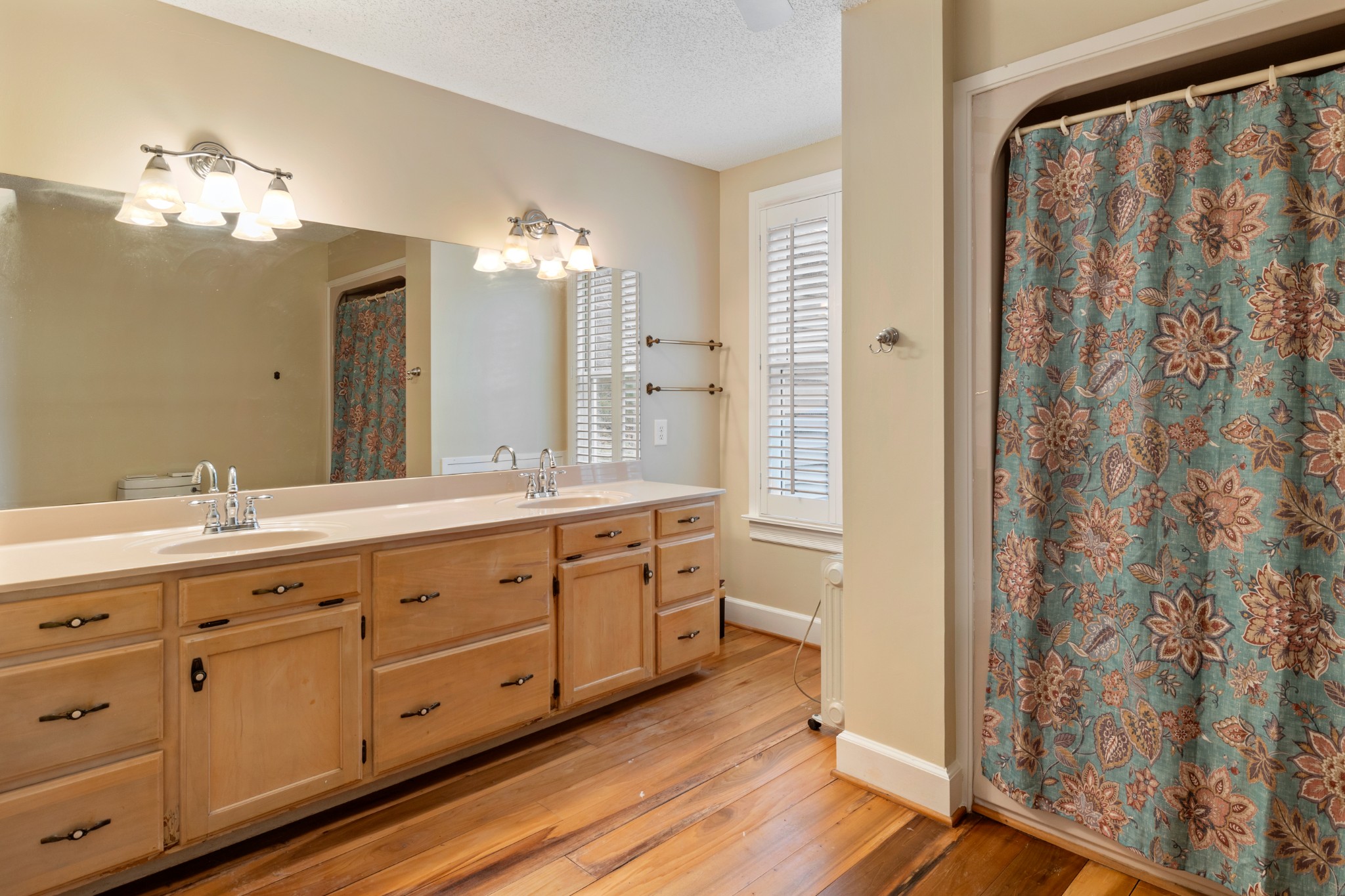 2600 Charlie Thomas Road Cornersville, TN 37047 - Photo 20 of 35 a spacious bathroom with double vanity a mirror and a shower