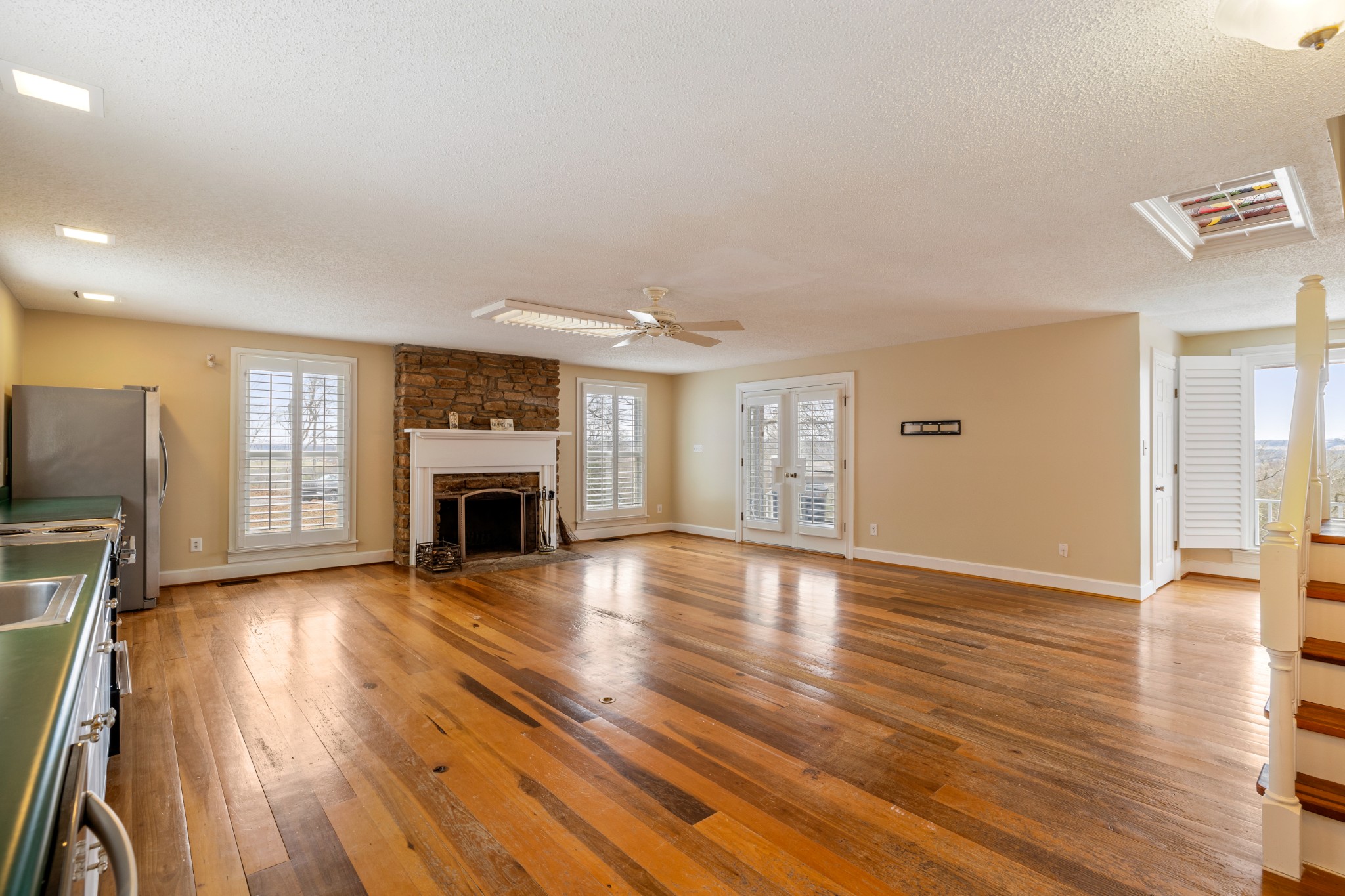 2600 Charlie Thomas Road Cornersville, TN 37047 - Photo 9 of 35 a view of a livingroom with wooden floor and a fireplace