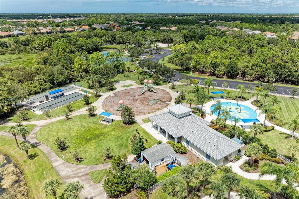 12642 Harney Street Venice, FL 34293 - Photo 63 of 85 an aerial view of house with yard swimming pool and outdoor seating