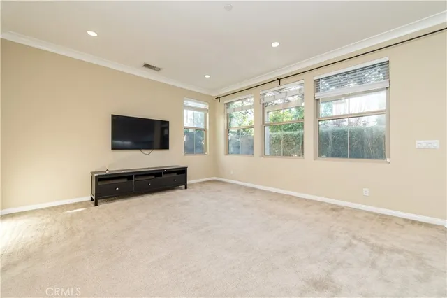 a room with furniture and flat screen tv