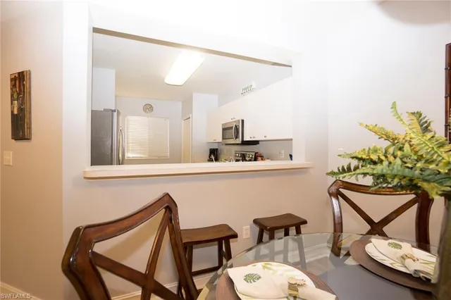 a kitchen with a table and chairs in it