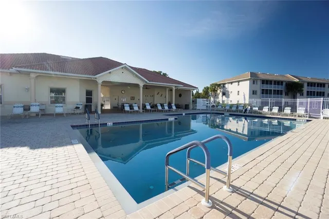 a view of a patio with dining table and chairs with wooden floor
