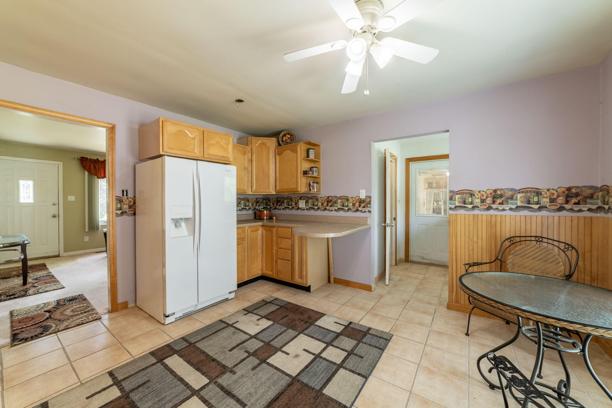 631 Osage Road Valparaiso, IN 46385 - Photo 5 of 14 a kitchen with a refrigerator a stove a sink and cabinets
