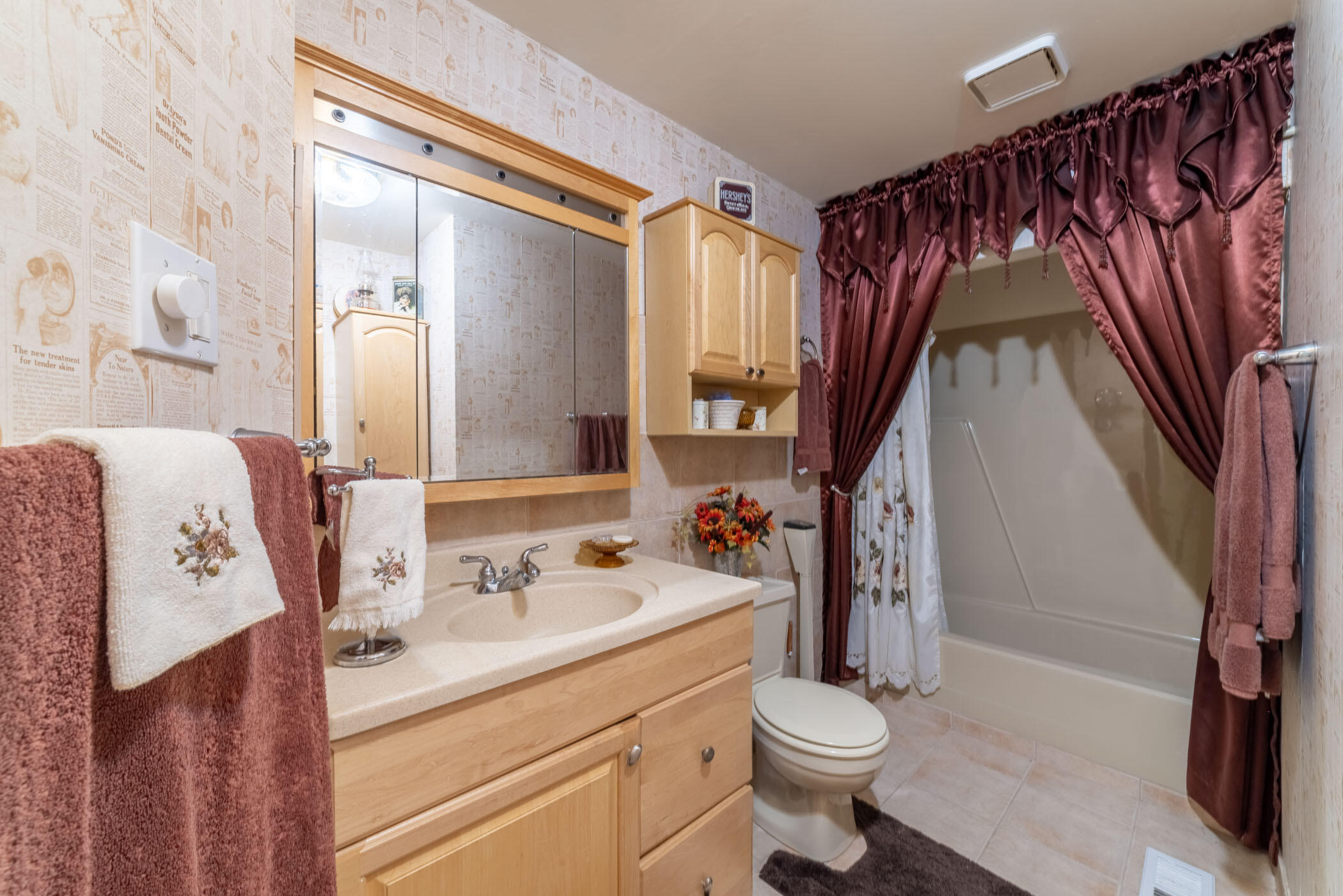 631 Osage Road Valparaiso, IN 46385 - Photo 9 of 14 a bathroom with a sink a toilet and shower