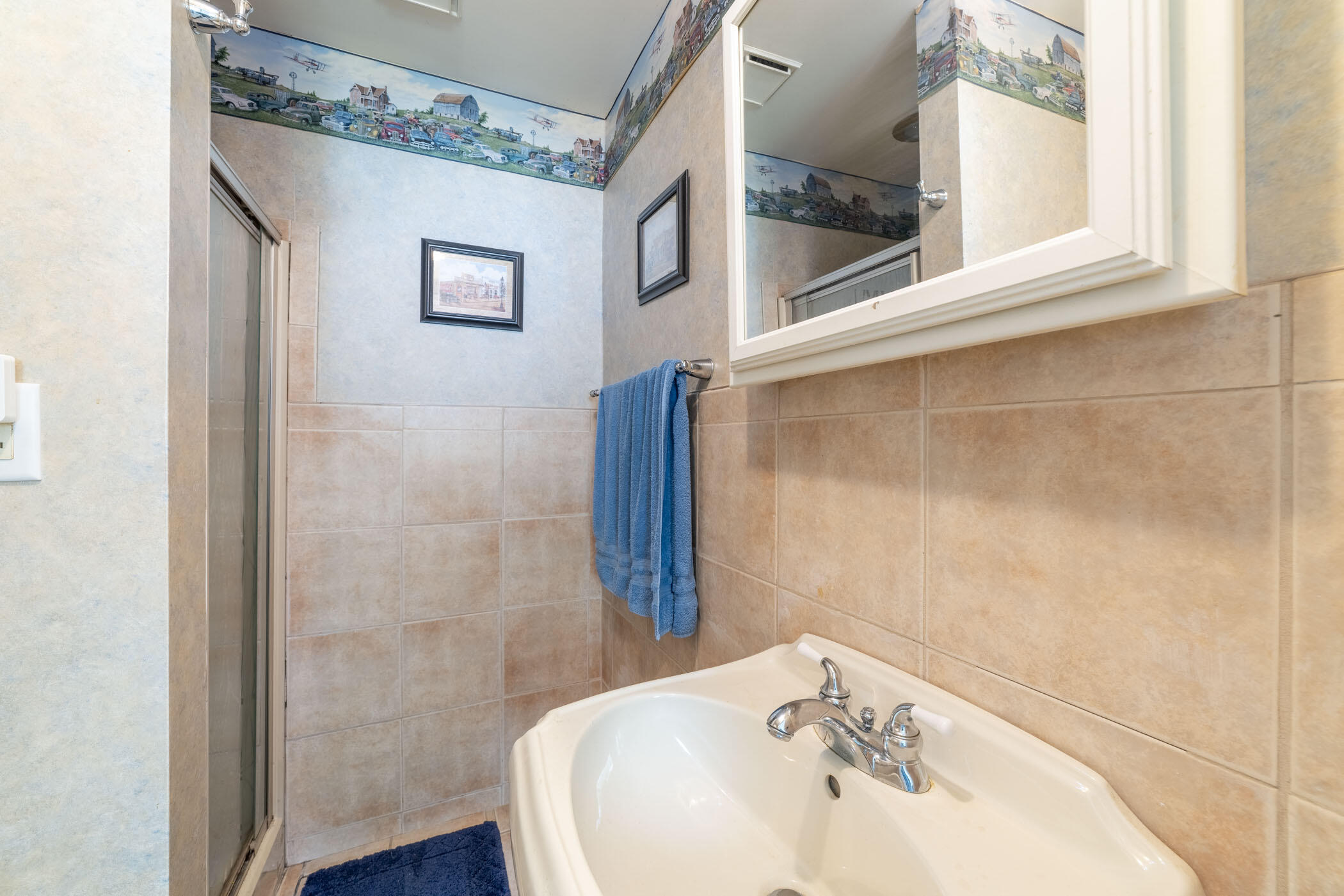 631 Osage Road Valparaiso, IN 46385 - Photo 10 of 14 a bathroom with a sink and a mirror