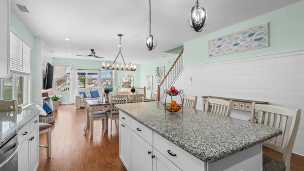 a kitchen with sink and center island