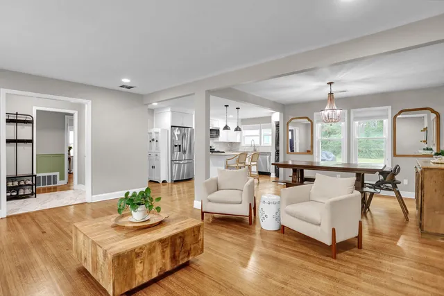 a living room with furniture and a table