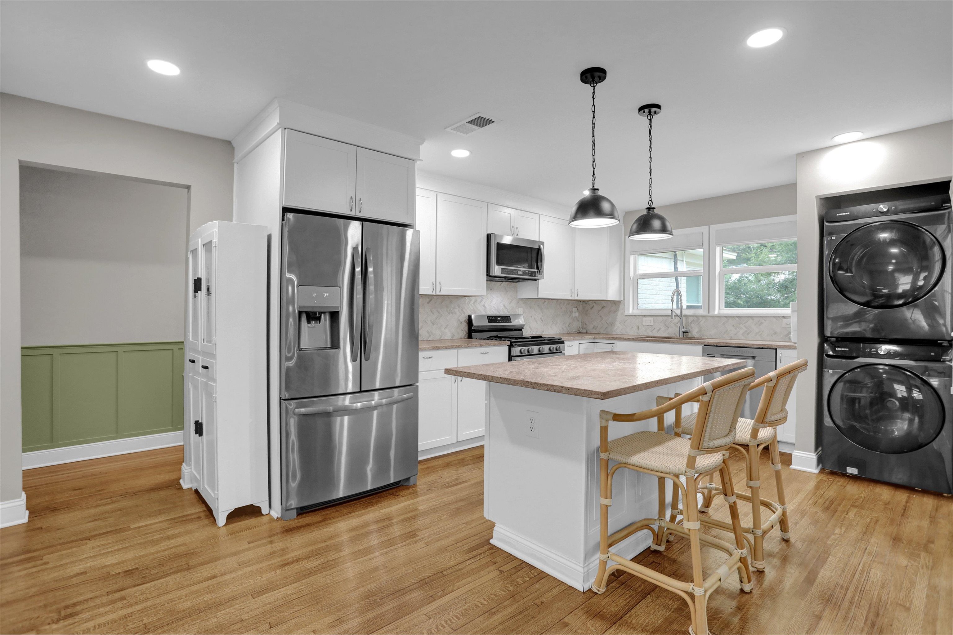 4344 Rhodes Avenue Memphis, TN 38111 - Photo 13 of 31 a kitchen with stainless steel appliances granite countertop a refrigerator a stove a sink and a microwave