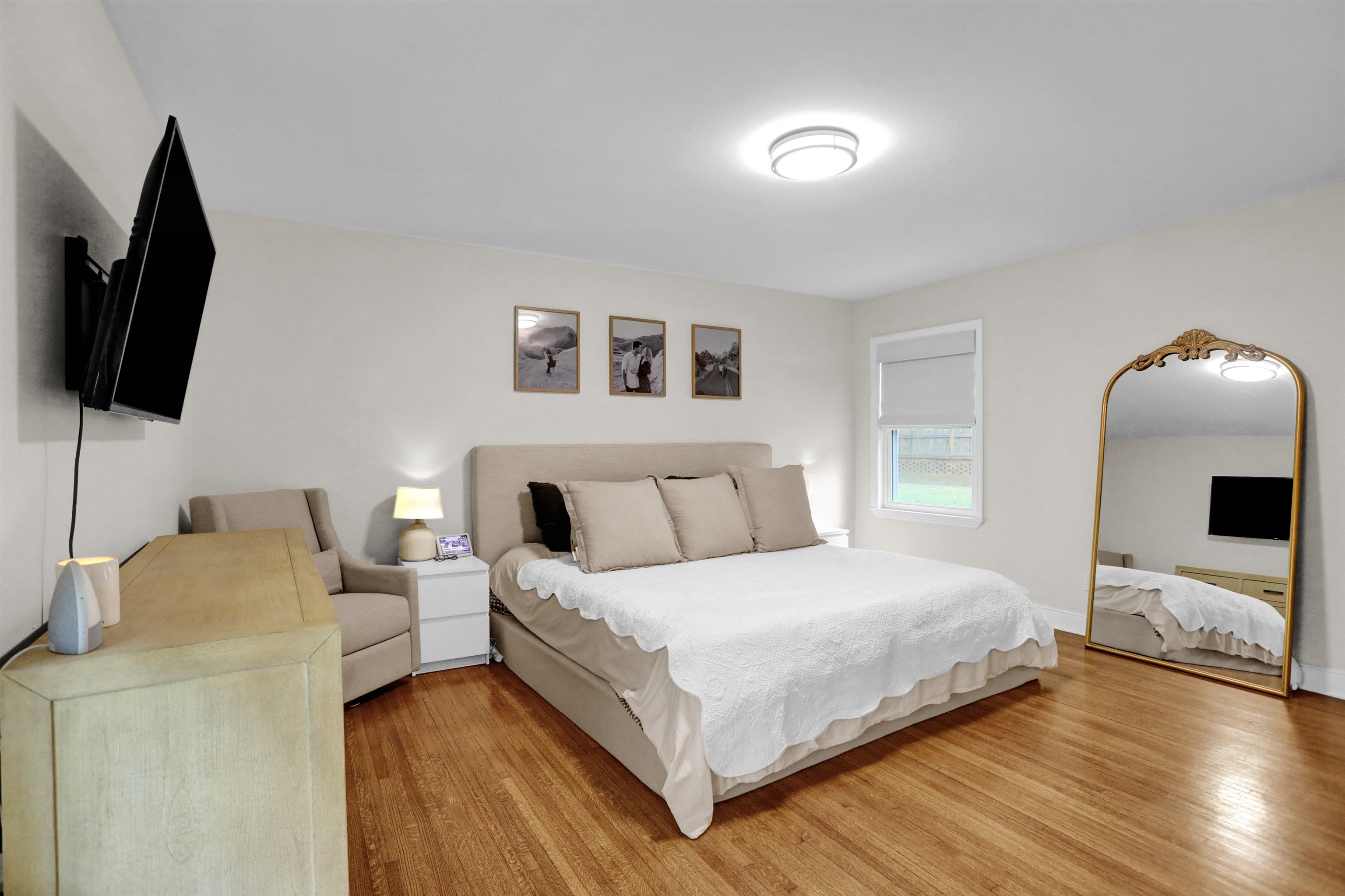 4344 Rhodes Avenue Memphis, TN 38111 - Photo 19 of 31 a bedroom with a bed and flat screen tv