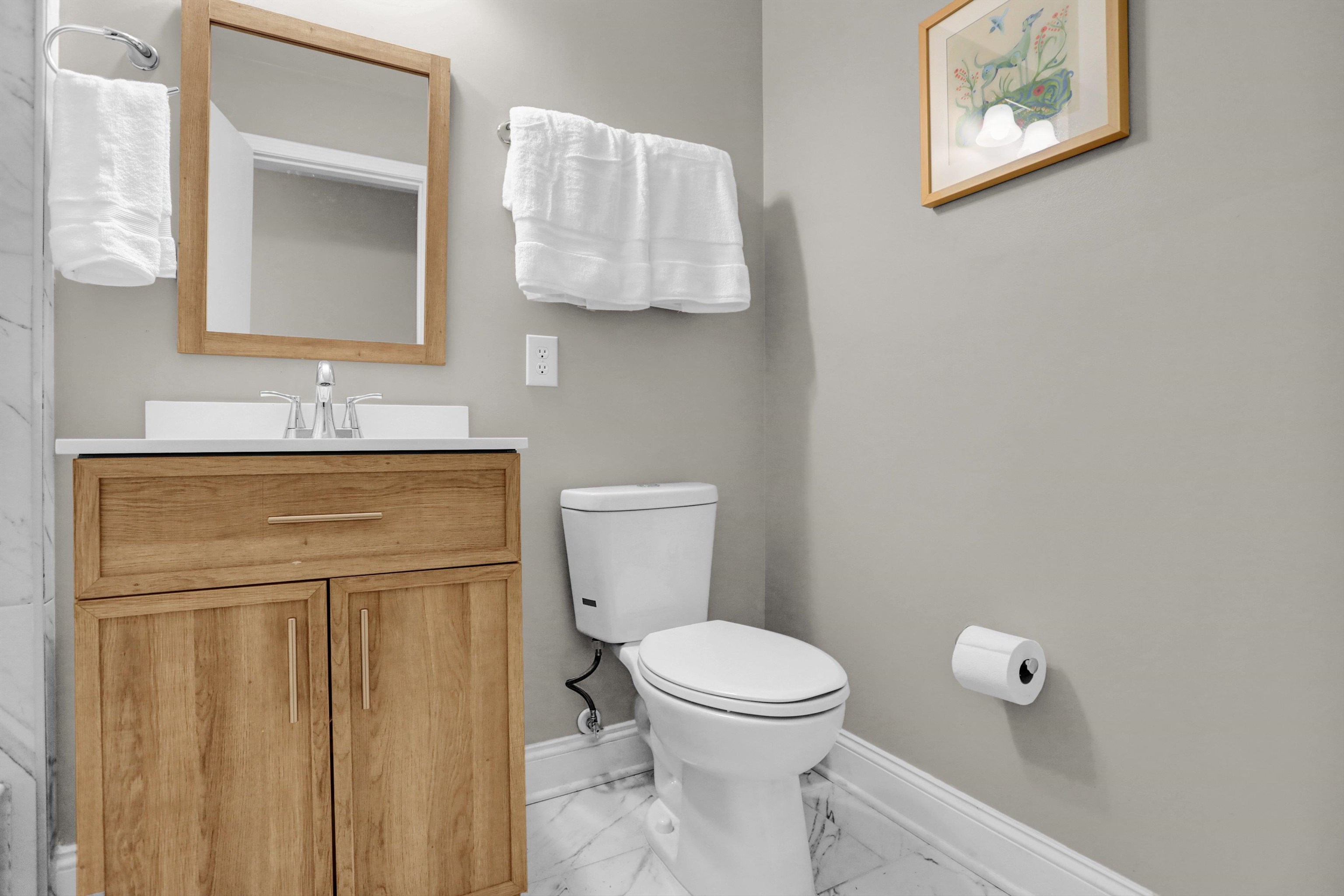 4344 Rhodes Avenue Memphis, TN 38111 - Photo 21 of 31 a bathroom with a toilet sink and mirror