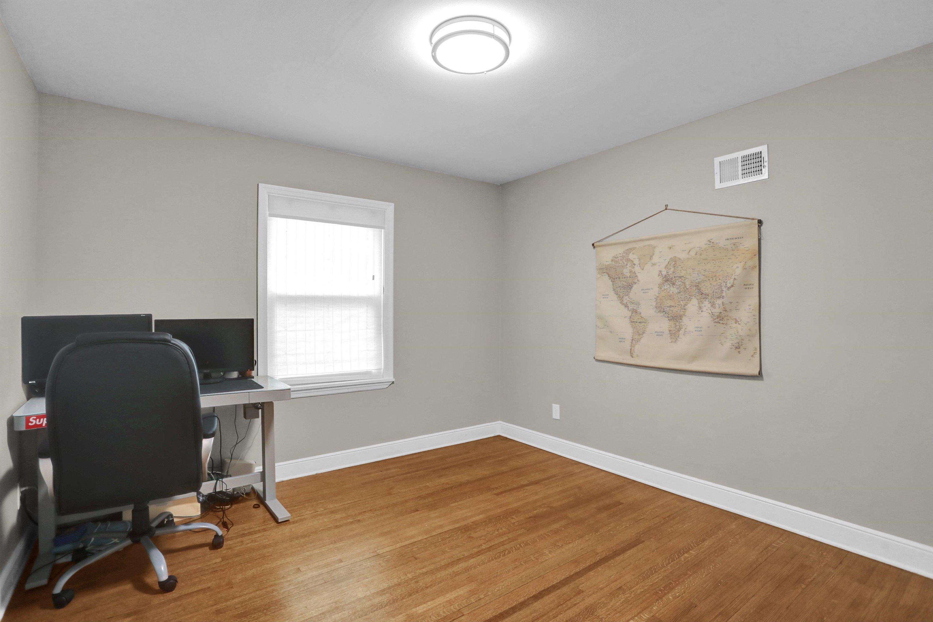 4344 Rhodes Avenue Memphis, TN 38111 - Photo 22 of 31 a view of workspace with wooden floor and a window