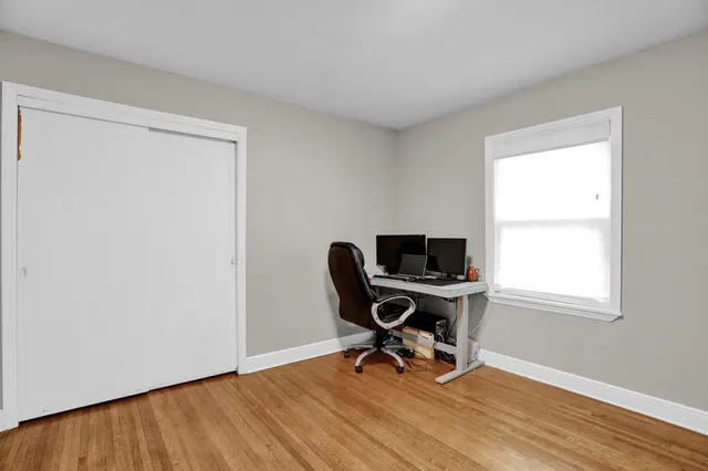 a view of room with furniture and wooden floor
