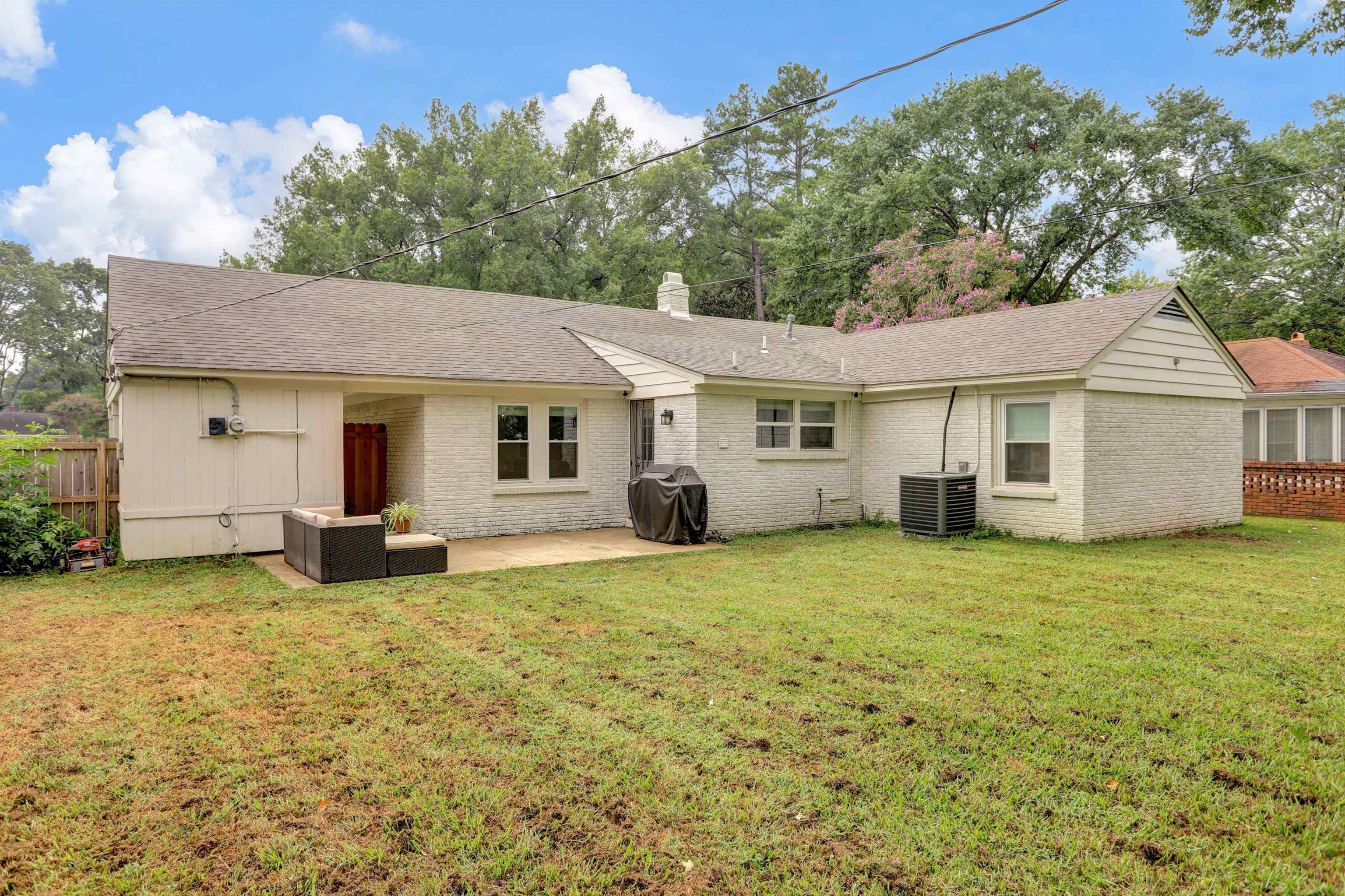 4344 Rhodes Avenue Memphis, TN 38111 - Photo 29 of 31 a big house with a big yard and large trees