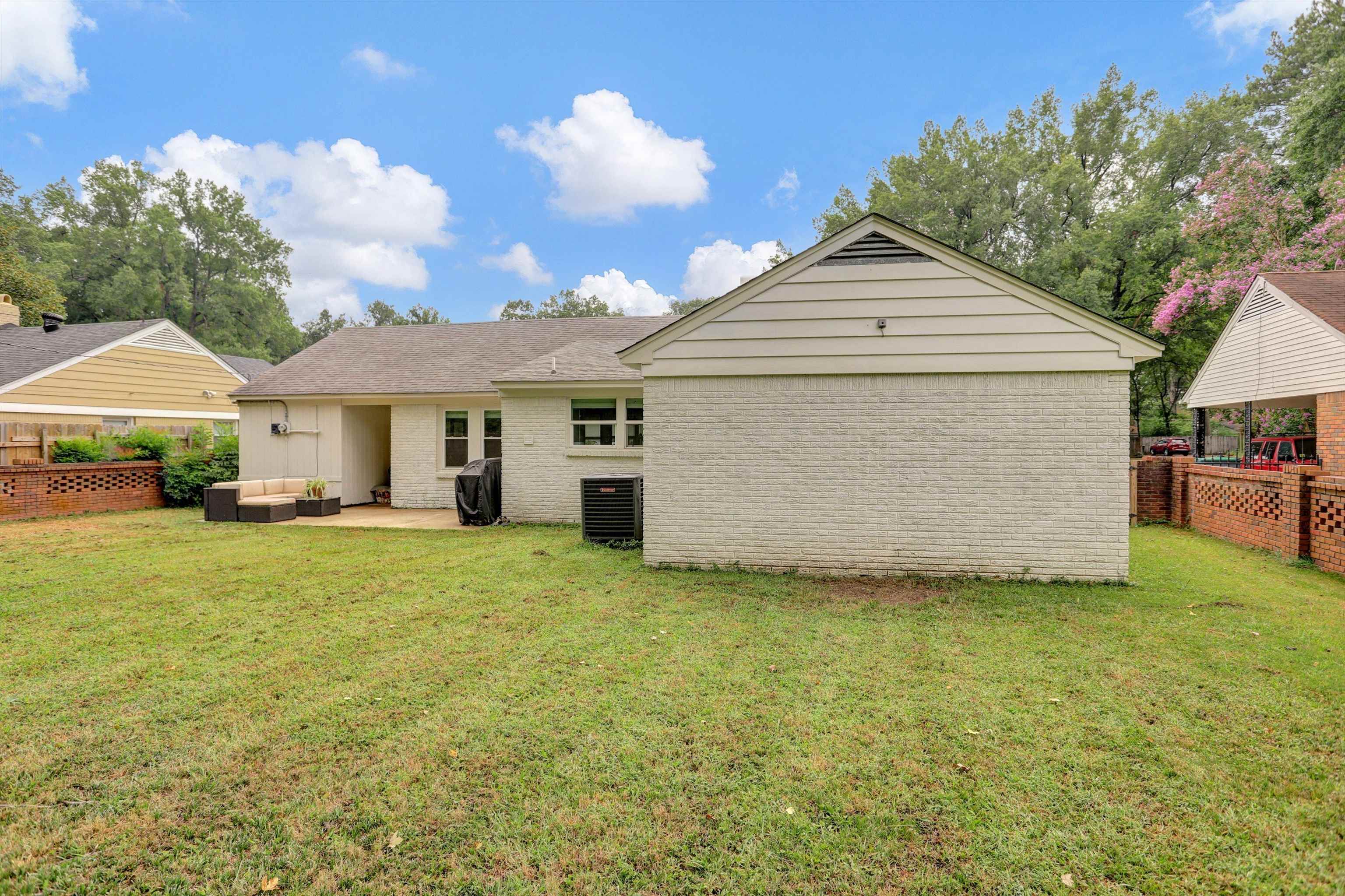 4344 Rhodes Avenue Memphis, TN 38111 - Photo 30 of 31 a front view of a house with a garden