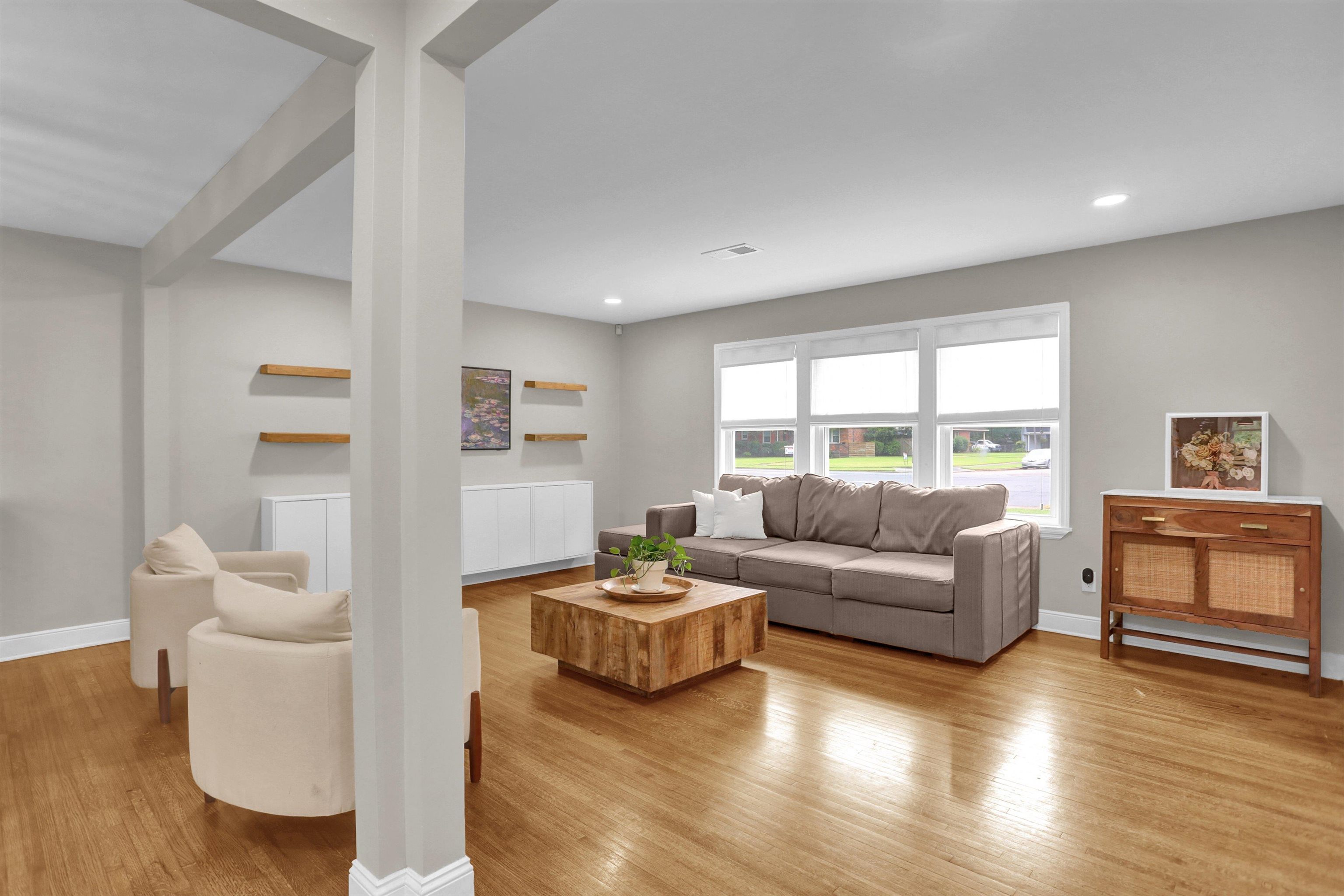 4344 Rhodes Avenue Memphis, TN 38111 - Photo 8 of 31 a living room with fireplace furniture and a wooden floor