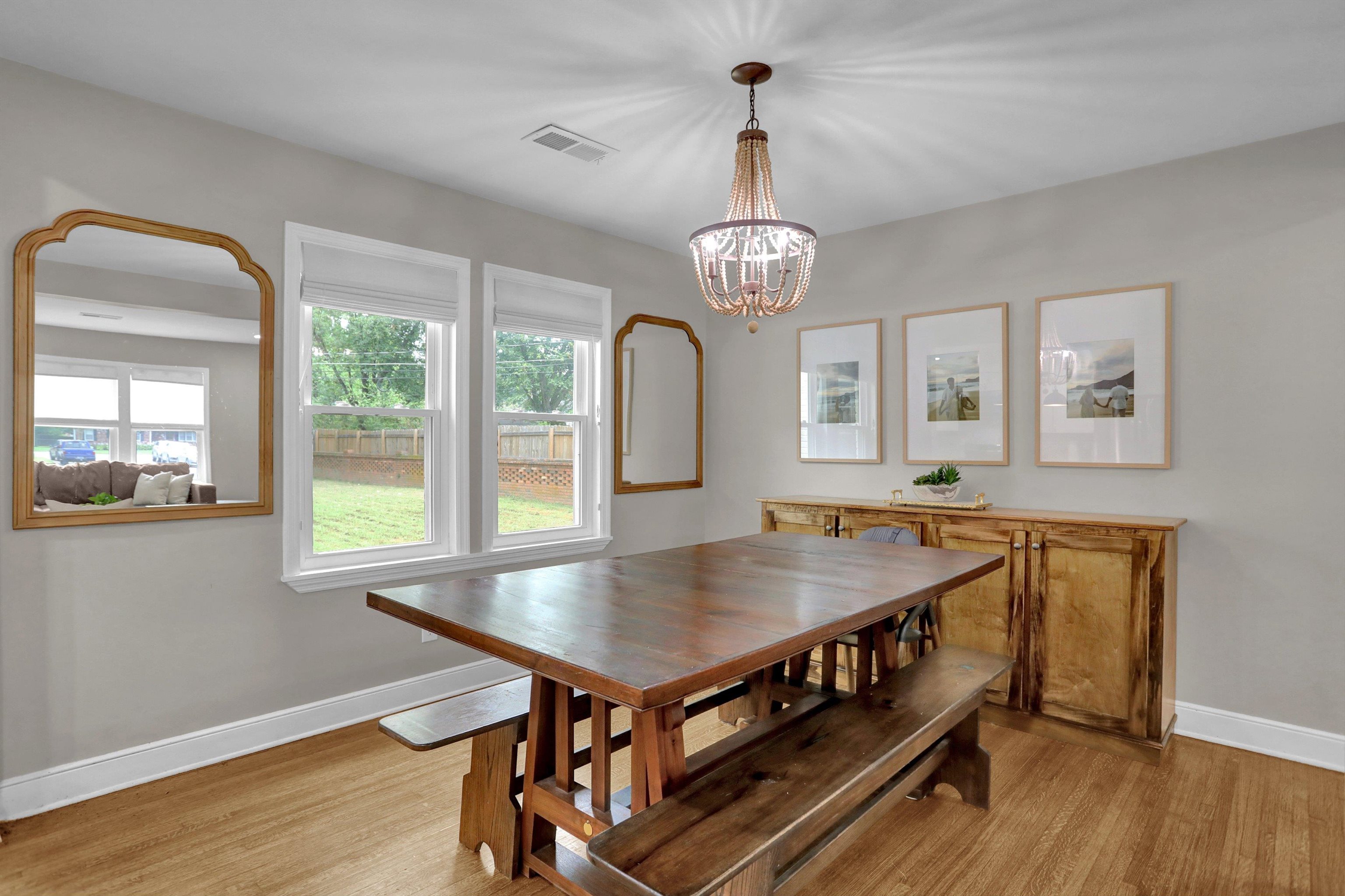 4344 Rhodes Avenue Memphis, TN 38111 - Photo 9 of 31 a view of a dining room with furniture window and wooden floor