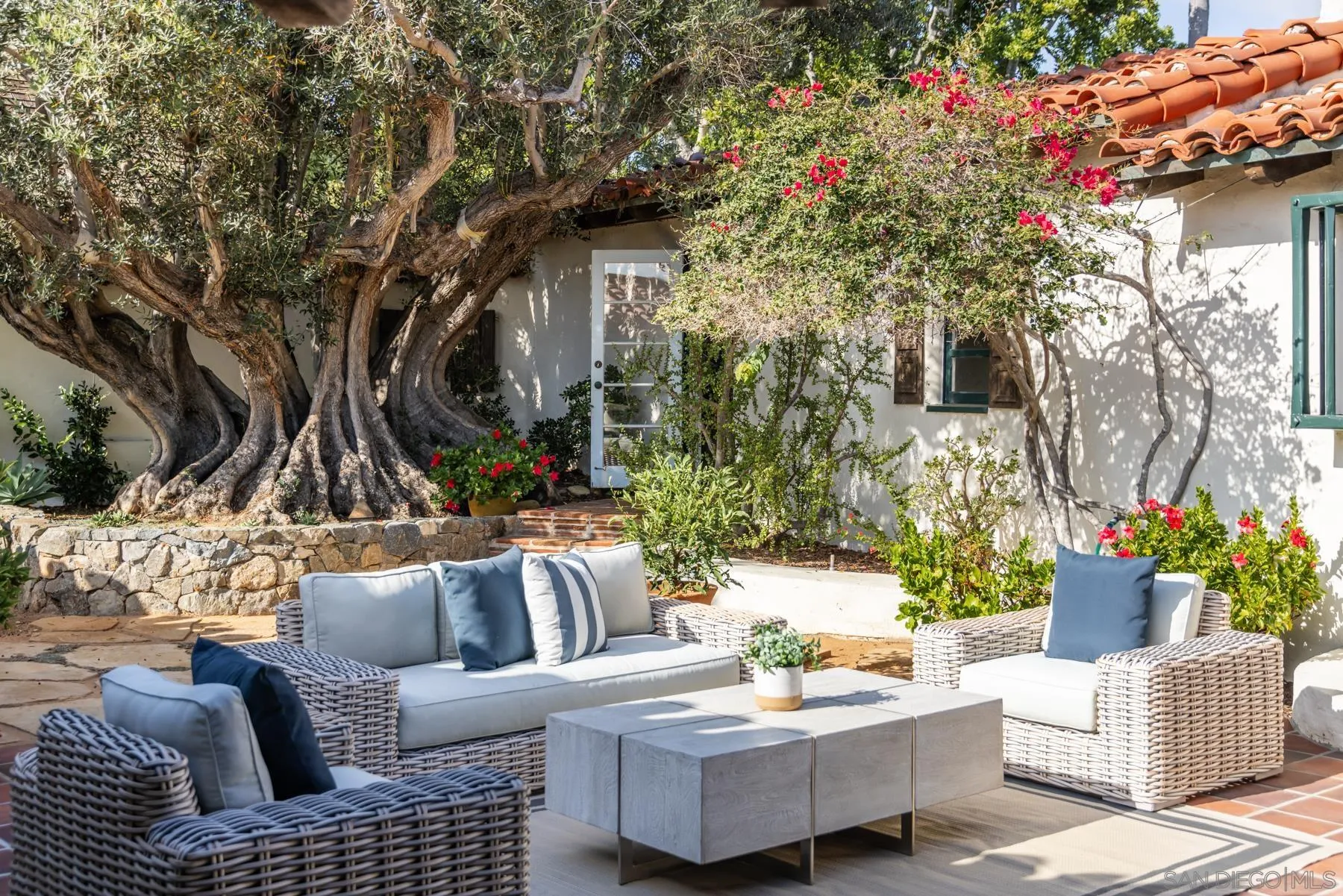 6004 Avenida Cresta La Jolla, CA 92037 - Photo 15 of 58 a view of a patio with couches and a potted plant on a table and chairs