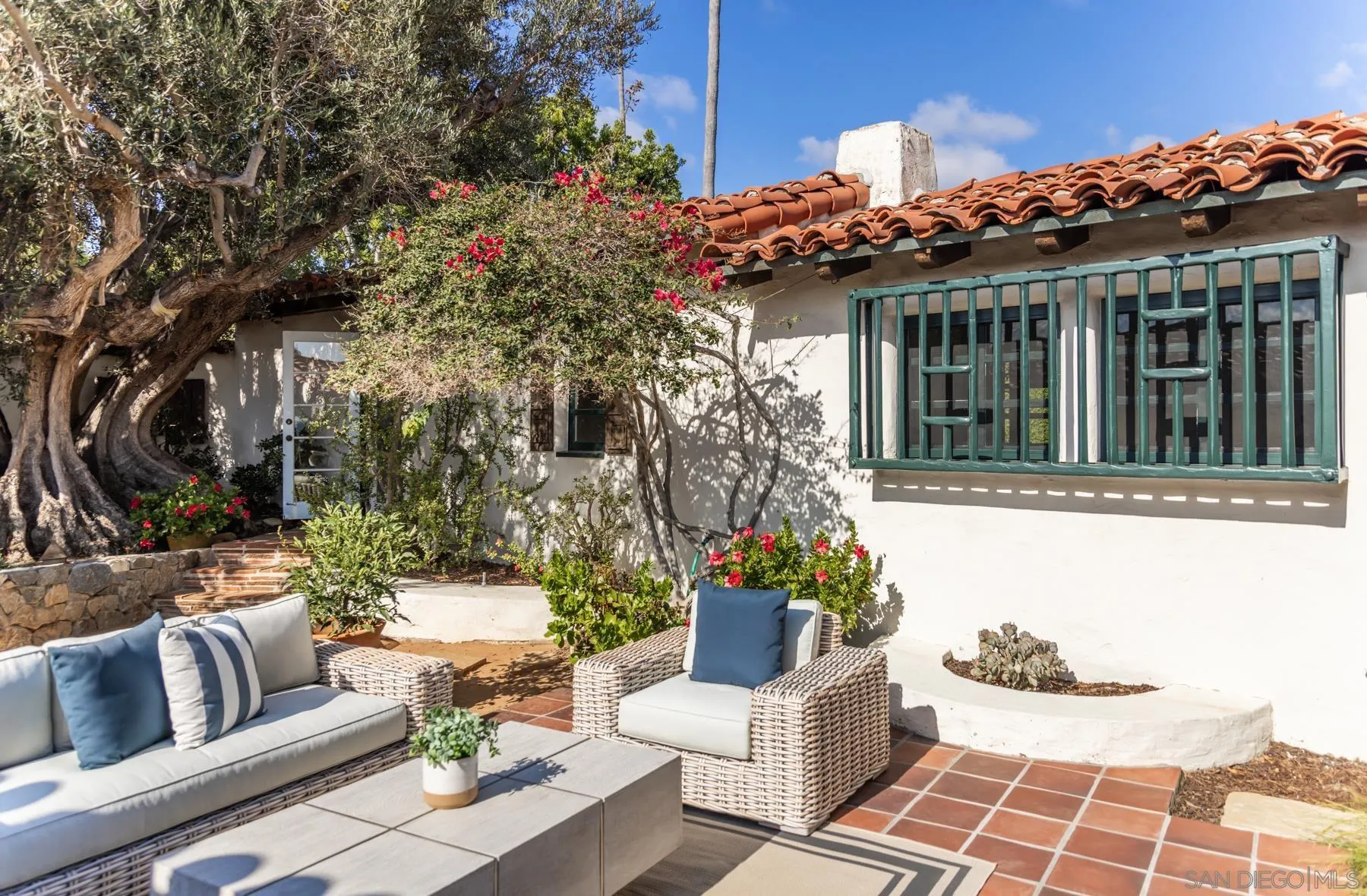 6004 Avenida Cresta La Jolla, CA 92037 - Photo 17 of 58 a view of a patio with couches table and chairs and potted plants