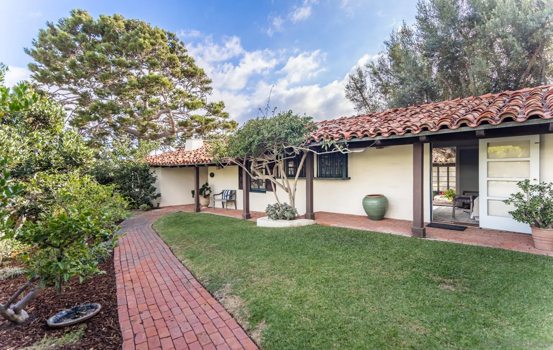 6004 Avenida Cresta La Jolla, CA 92037 - Photo 3 of 58 a front view of a house with garden
