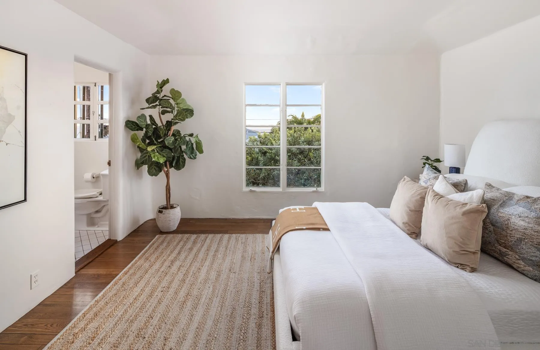 6004 Avenida Cresta La Jolla, CA 92037 - Photo 32 of 58 a bedroom with a bed and a window
