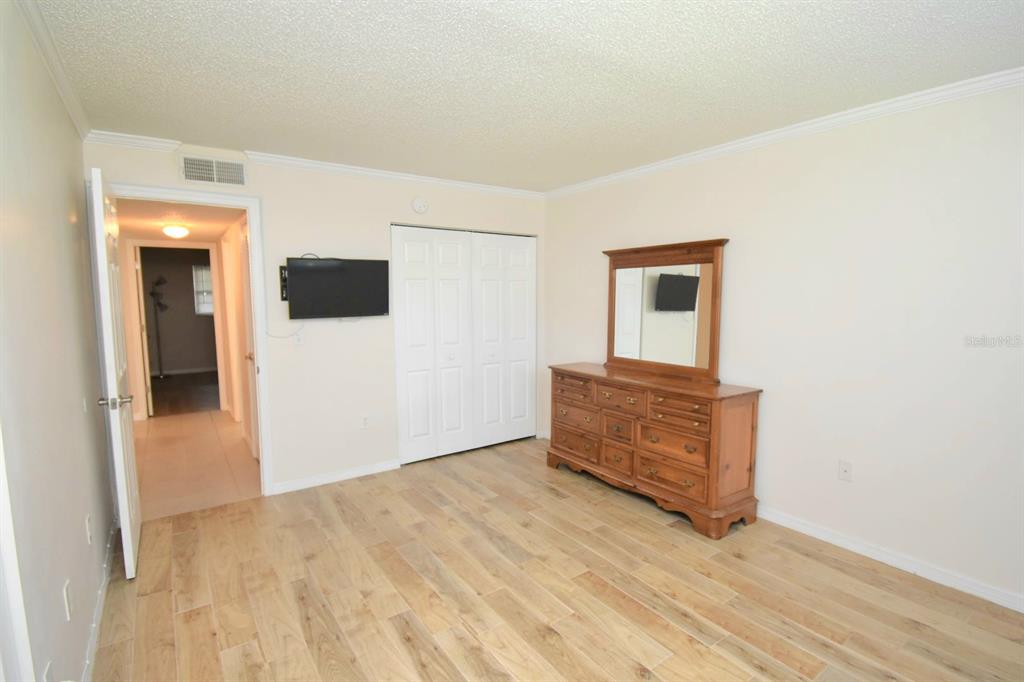 946 Virginia Street, Unit 102 Dunedin, FL 34698 - Photo 14 of 30 wooden floor in an empty room