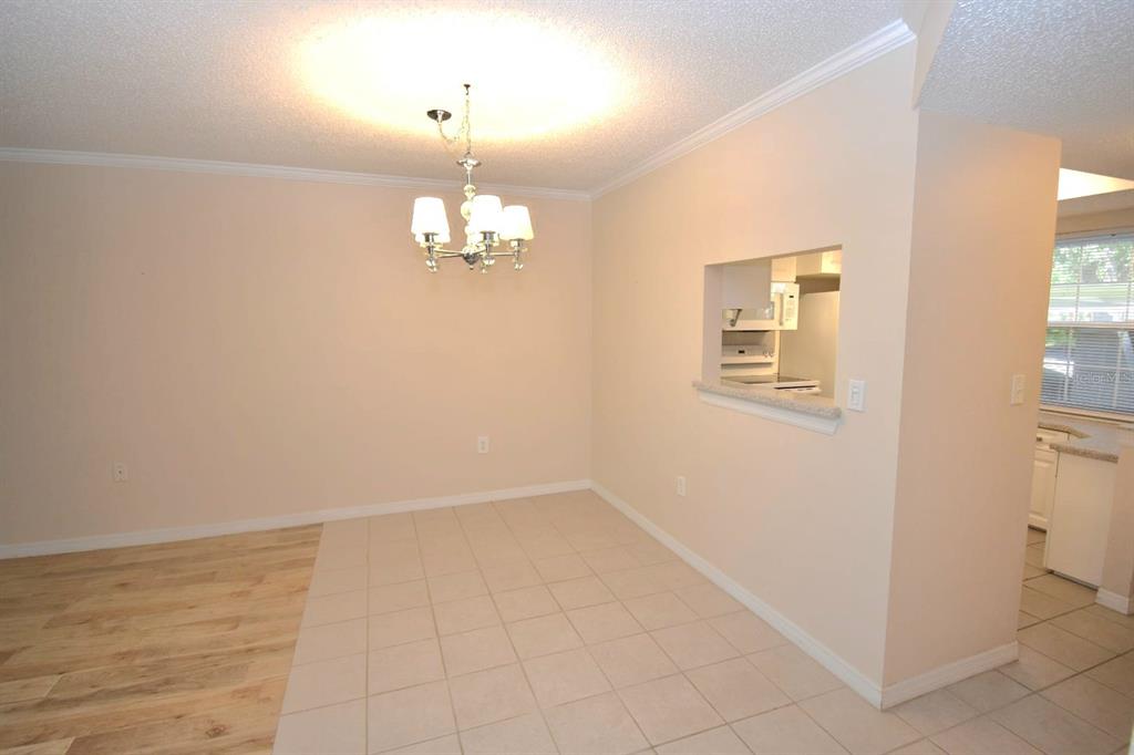 946 Virginia Street, Unit 102 Dunedin, FL 34698 - Photo 9 of 30 en empty room with wooden floor