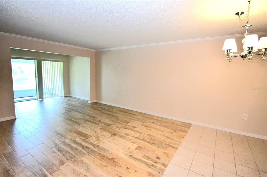 946 Virginia Street, Unit 102 Dunedin, FL 34698 - Photo 10 of 30 a view of an empty room and a window