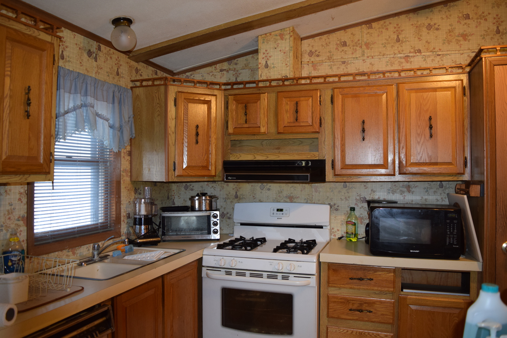 746 Chapparal Terrace Matteson, IL 60443 - Photo 5 of 17 a kitchen with stainless steel appliances granite countertop a stove sink and cabinets