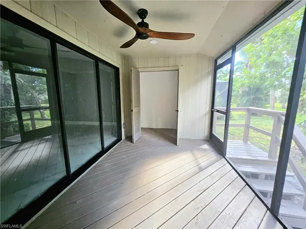 an aerial view of lake residential house with swimming pool and outdoor seating
