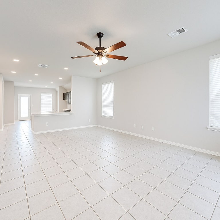 913 Centerra Hills Circle Round Rock, TX 78665 - Photo 2 of 10 Empty room with light tile patterned floors, a ceiling fan, and recessed lighting