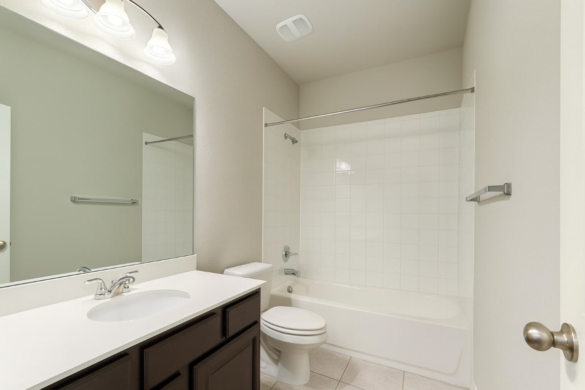 913 Centerra Hills Circle Round Rock, TX 78665 - Photo 8 of 10 Full bath featuring bathtub / shower combination, light tile patterned floors, and vanity