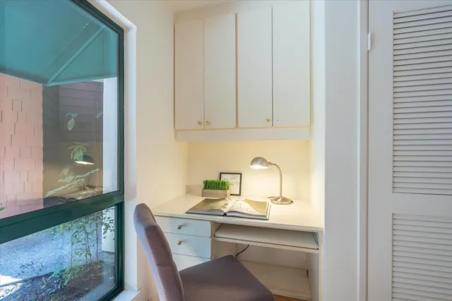 a very nice looking dining room with kitchen island granite countertop a sink and a granite counter top space