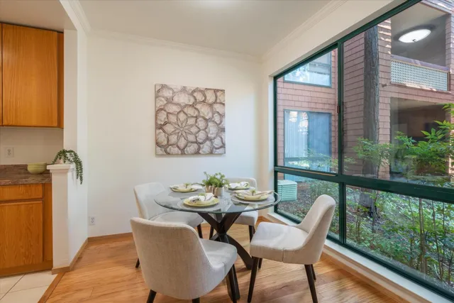 a view of an outdoor dining space with a table and chairs
