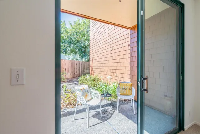 a bedroom with a bed and a night stand