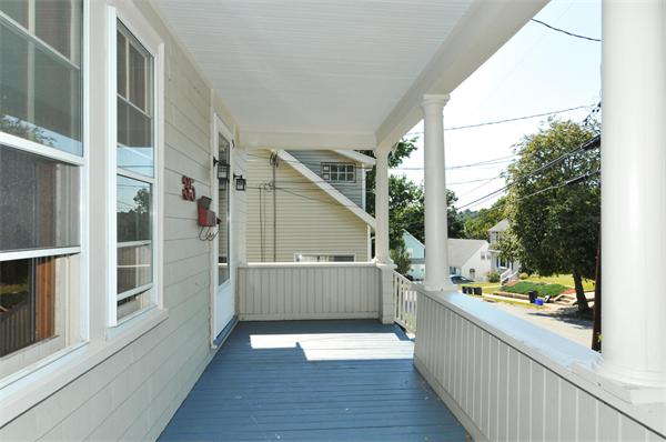 35 Overlook Road Arlington, MA 02474 - Photo 19 of 20 a view of a porch with wooden floor and iron fence