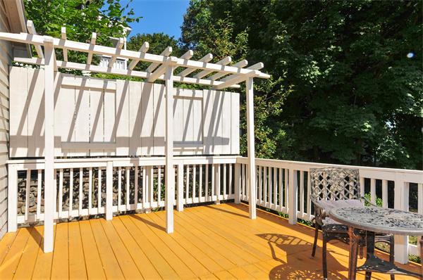 35 Overlook Road Arlington, MA 02474 - Photo 3 of 20 a view of a chair and tables on the roof deck