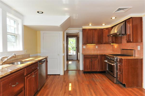 35 Overlook Road Arlington, MA 02474 - Photo 4 of 20 a kitchen with granite countertop wooden floors and stainless steel appliances